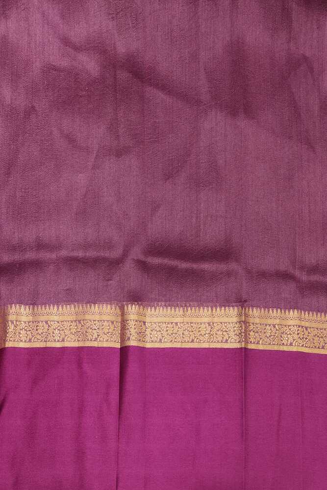 Purple Tussar Banarasi silk saree with hand-woven motifs and matching unstitched blouse, traditional wear by Saarang Sarees.