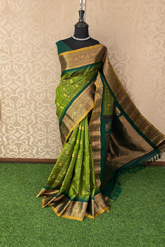 Elegant green Gadwal silk saree with intricate traditional designs and matching unstiched blouse from Saarang Sarees.