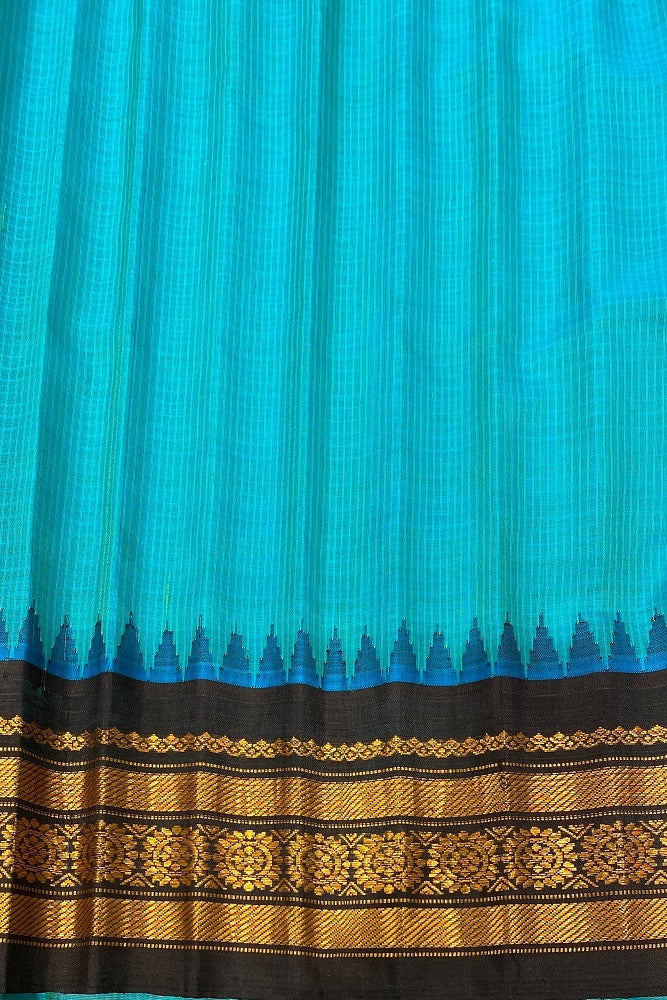 Blue Sico Gadwal saree with intricate gold zari work and matching unstiched blouse, traditional Indian wear by Saarang Sarees.