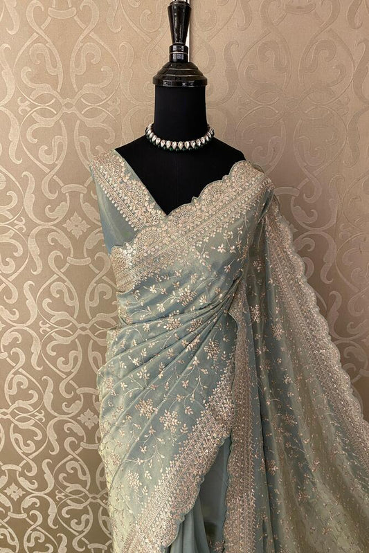 Light blue tissue organza silk saree with embroidery and unstiched blouse, perfect for party wear by Saarang Sarees.
