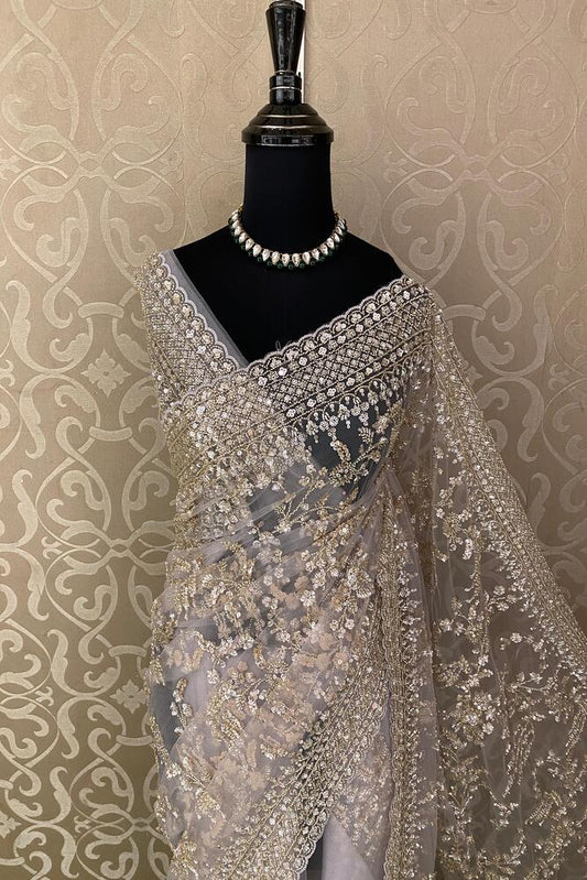 Lavender party wear net embroidered saree with matching readymade blouse from Saarang Sarees, detailed embroidery, elegant design.