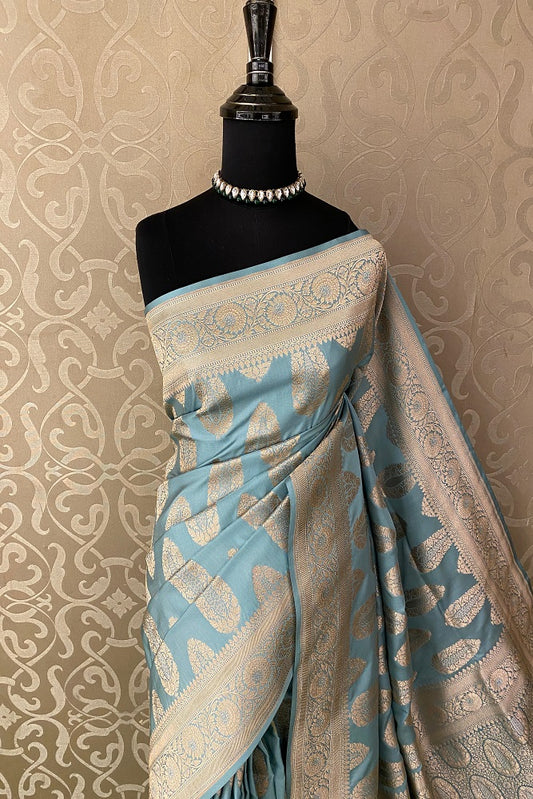 Sky Uppada Banarasi saree with intricate gold zari work and a matching unstiched blouse, traditional Indian wear by Saarang Sarees.