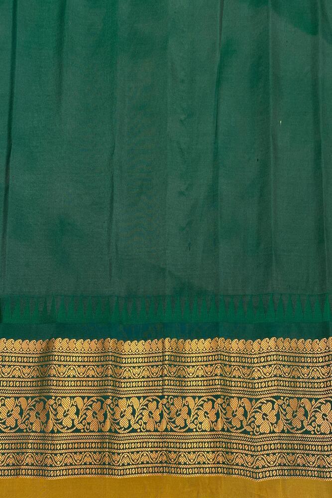 Green Gadwal silk saree from Saarang Sarees with traditional design and matching unstiched blouse, displayed on a hanger.