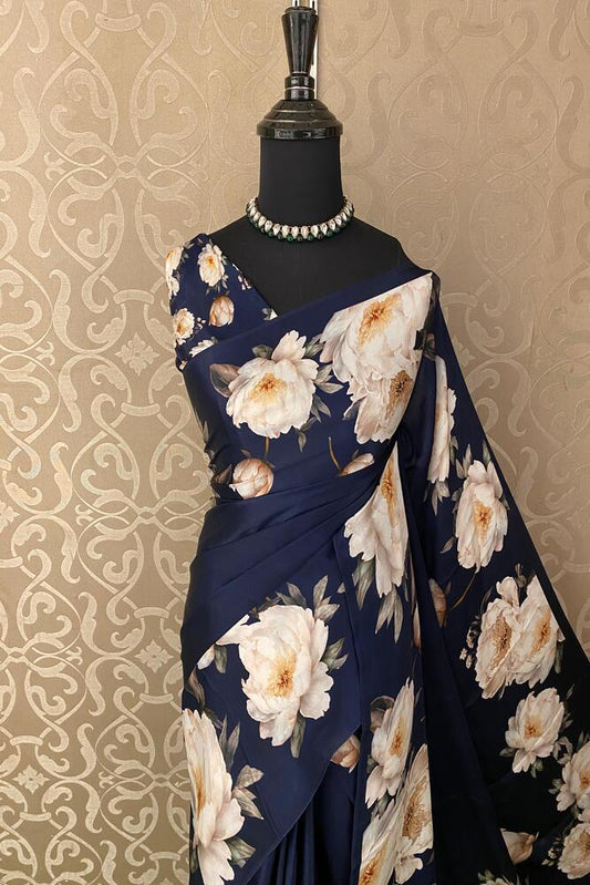 Dark blue and white floral printed satin crepe saree with a matching unstiched blouse, ideal for party wear.