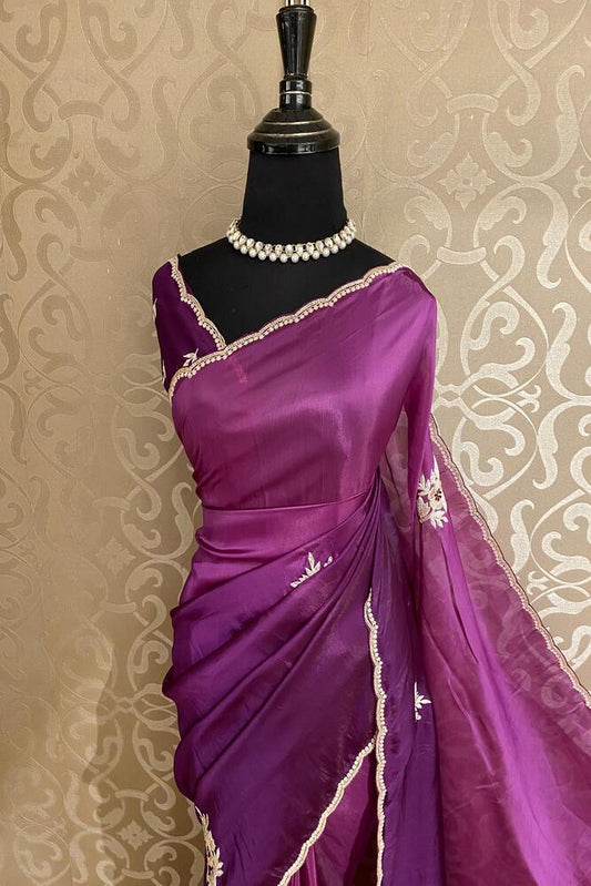 Purple soft organza silk party wear saree with intricate embroidery and unstiched blouse by Saarang Sarees.