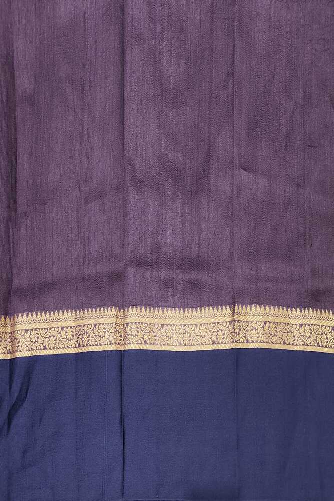 Purple and navy blue Tussar Banarasi silk saree with hand-woven motifs and an unstitched blouse, traditional wear by Saarang Sarees.