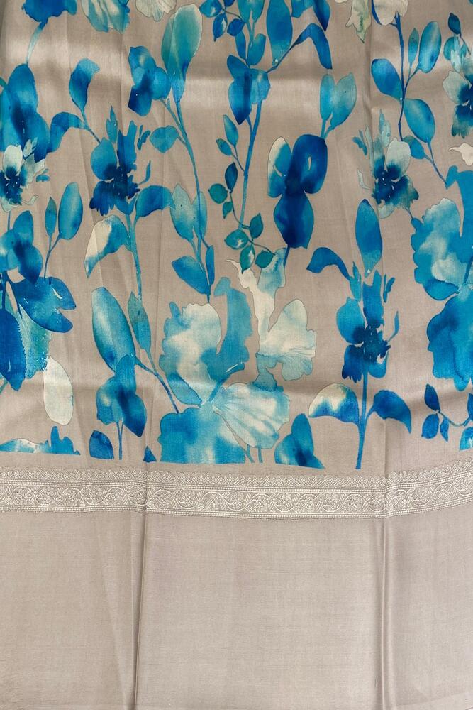 Beige Tussar Banarasi saree with digital mashru border, traditional wear by Saarang Sarees featuring intricate gold and silver zari work.