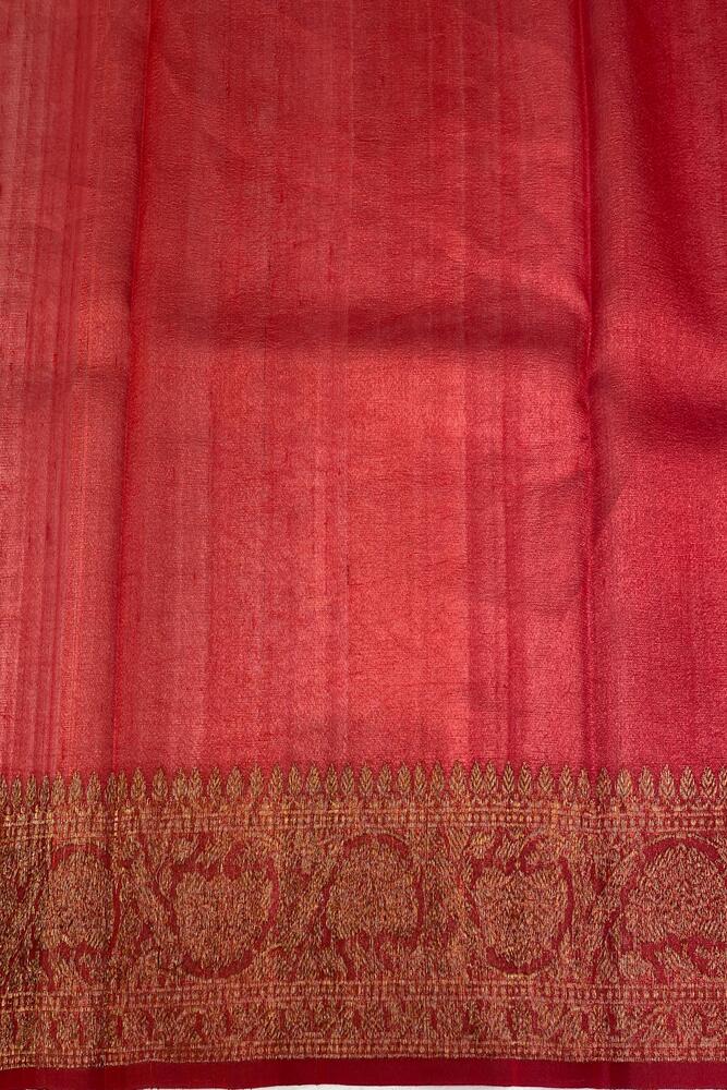 Black Tussar Banarasi silk saree with hand-woven motifs and an unstitched blouse, traditional wear by Saarang Sarees.