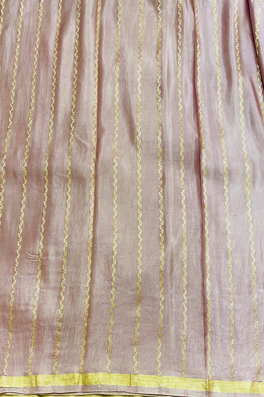 Pink Mashru silk Banarasi saree with intricate gold patterns and matching unstiched blouse, traditional handloom wear by Saarang Sarees.