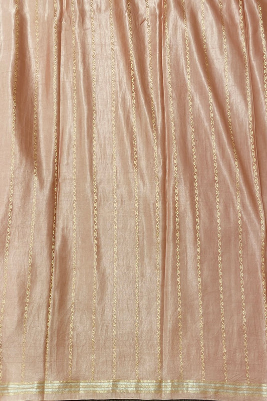Peach pink Mashru silk Banarasi handloom saree with intricate gold zari work and matching unstitched blouse, traditional wear.