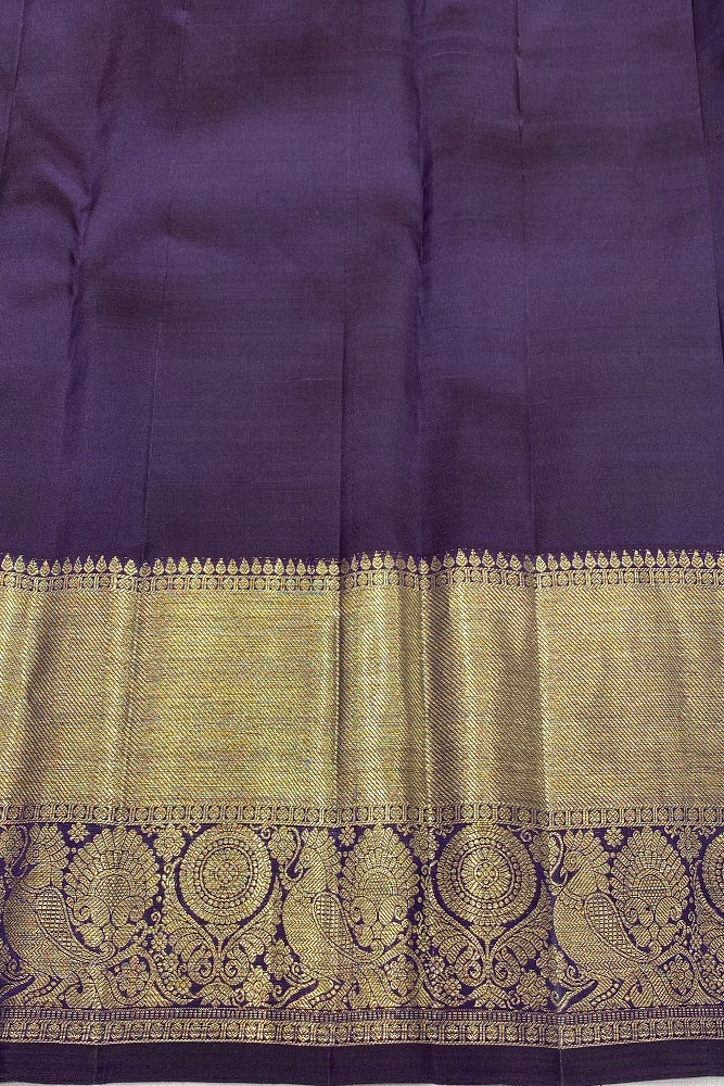 Magenta pure Kanjeevaram silk saree from Saarang Sarees with an unstiched blouse, traditional Indian wear, detailed fabric pattern.