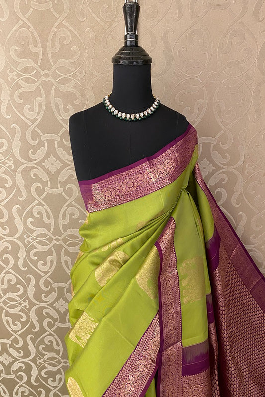 Lime green pure Kanjeevaram silk saree with intricate gold borders and unstiched blouse, traditional wear by Saarang Sarees.