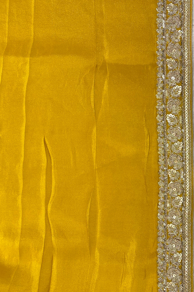 Mustard yellow Banarasi silk saree with intricate Zardosi border and matching unstiched blouse, traditional wear by Saarang Sarees.