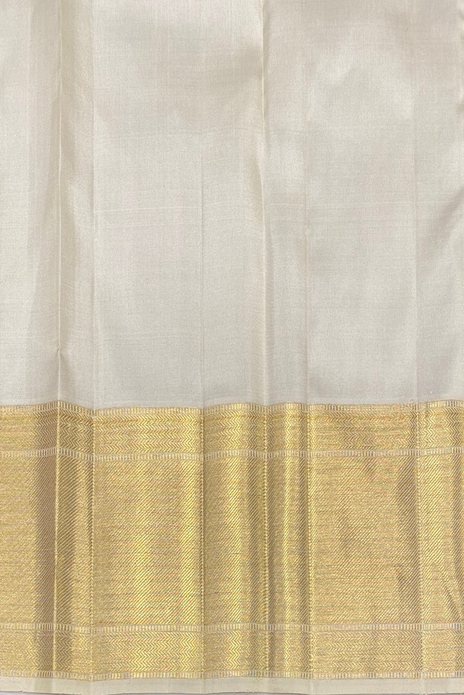 Elegant offwhite gold Kanjeevaram silk saree with intricate borders and a matching unstitch blouse, traditional wear by Saarang Sarees.