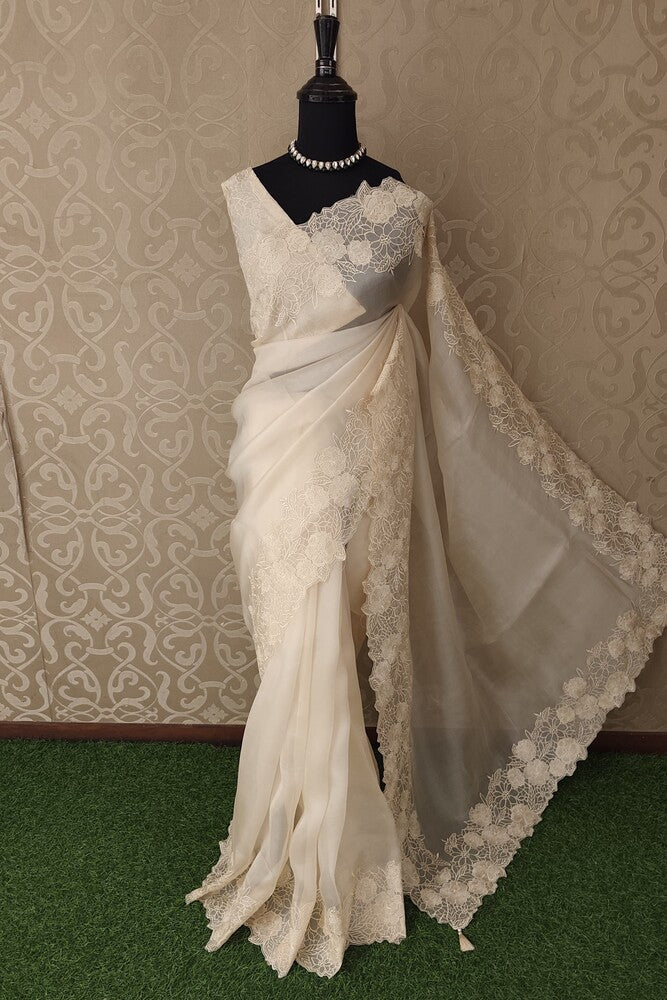 Off-White Organza Silk Saree with Resham Embroidery and unstiched blouse, perfect for party wear from Saarang Sarees.