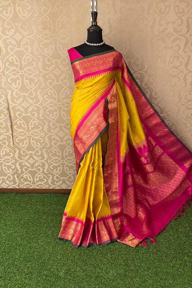 Mustard yellow Gadwal silk saree with intricate traditional patterns and an unstiched blouse, crafted by Saarang Sarees.