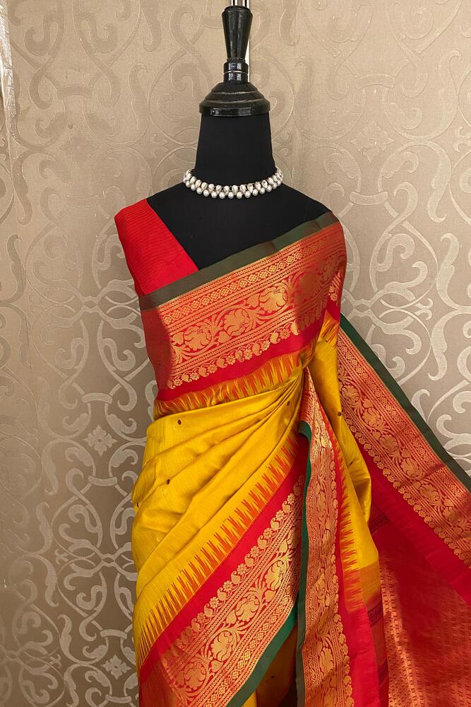 Mustard yellow Gadwal silk saree with traditional design and unstiched blouse, crafted by Saarang Sarees for elegant wear.