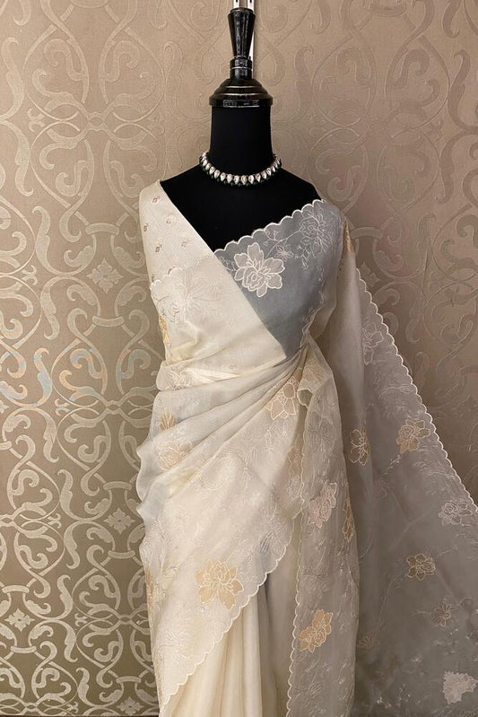 Off-White organza silk saree with embroidery and unstiched blouse, perfect for party wear from Saarang Sarees.
