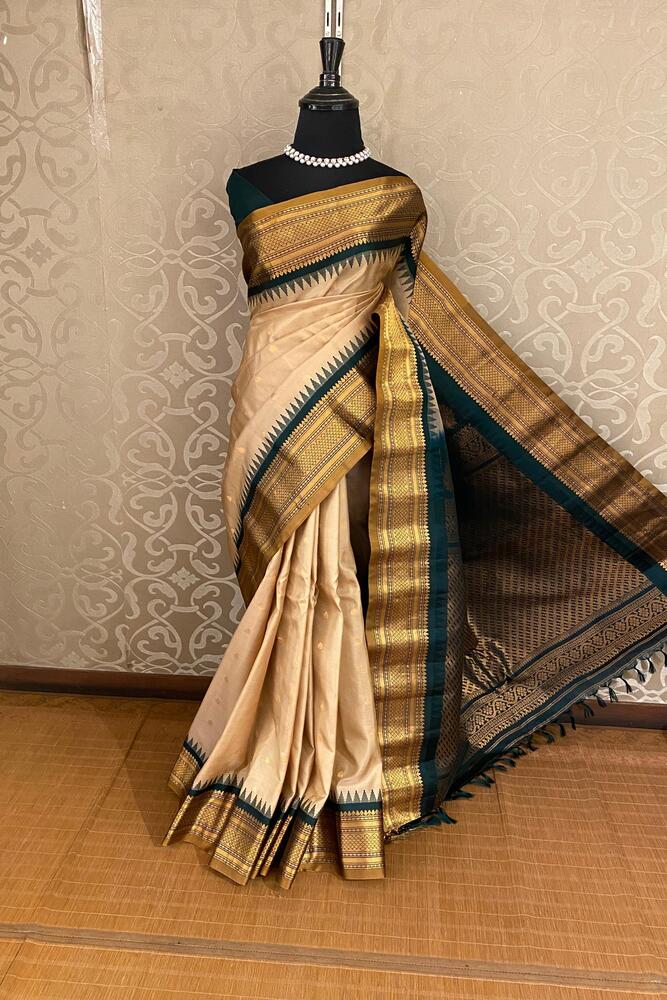 Beige Gadwal silk saree with intricate traditional design and unstiched blouse, crafted by Saarang Sarees for elegant traditional wear.