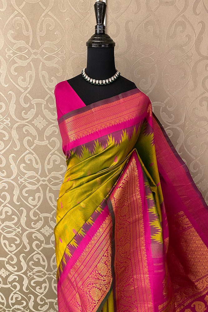 Golden lime green Gadwal silk saree with intricate motifs and matching unstiched blouse from Saarang Sarees, traditional wear.