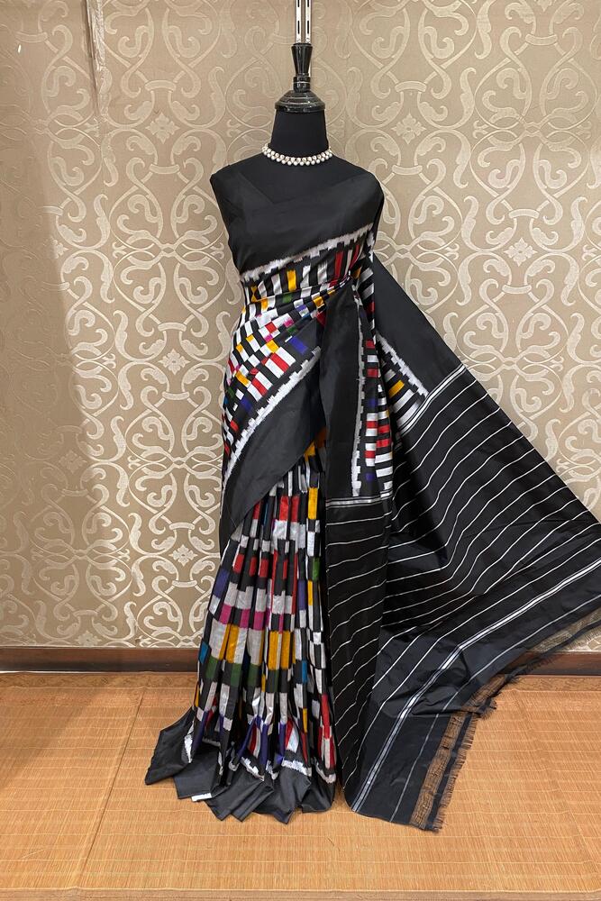 Black and multi-colored Pochampally Ikat silk saree by Saarang Sarees with an unstiched blouse, showcasing intricate traditional ikat patterns.