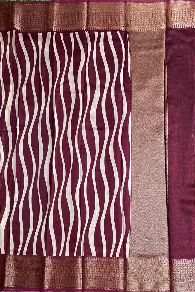Elegant Wine Cotton Chanderi Saree with intricate traditional design and an unstiched blouse for traditional wear by Saarang Sarees.
