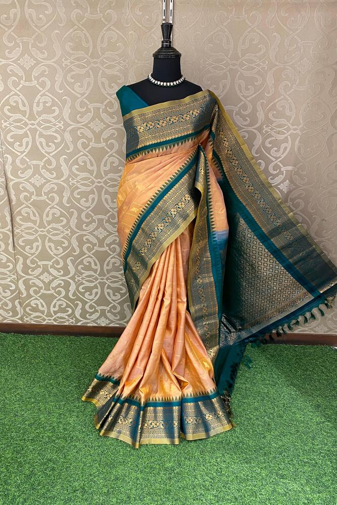 Golden peach Gadwal silk saree from Saarang Sarees with unstiched blouse, showcasing intricate traditional Indian weaving and rich fabric details.