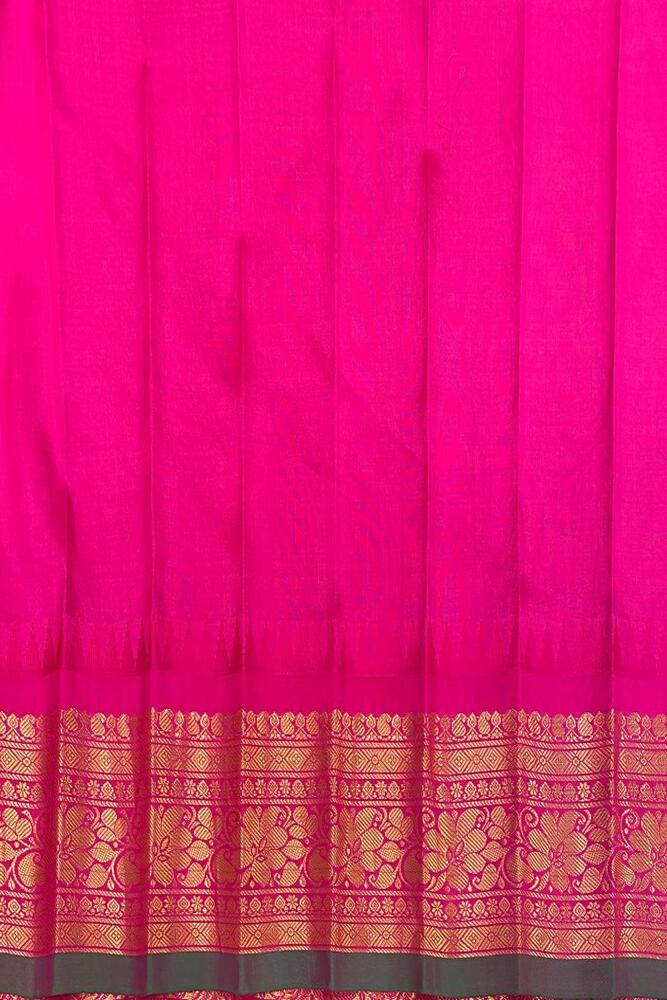 Mustard yellow Gadwal silk saree with unstitched blouse from Saarang Sarees, traditional Indian attire displayed on a hanger.