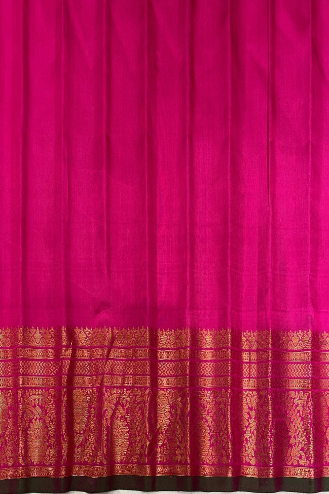 Golden lime green Gadwal silk saree with intricate traditional patterns and matching unstiched blouse by Saarang Sarees.
