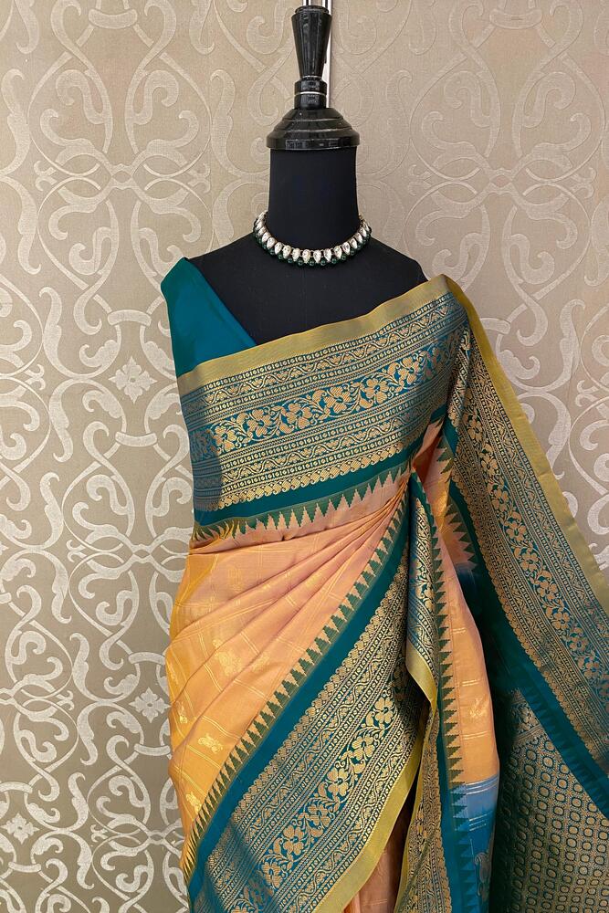 Golden peach Gadwal silk saree with traditional design and unstiched blouse from Saarang Sarees, showcasing intricate weaving.