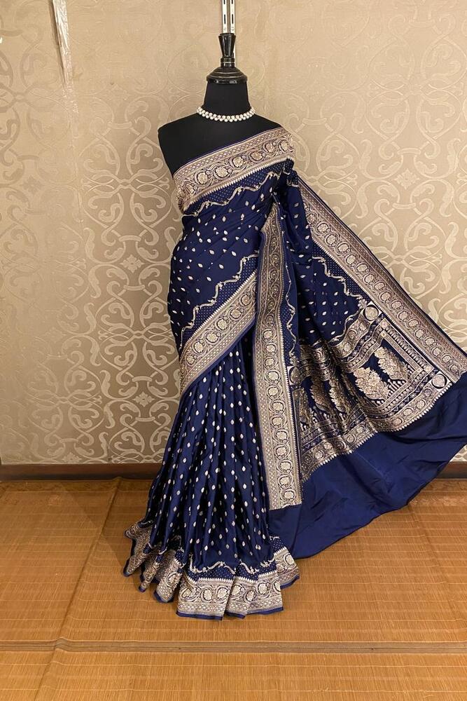 Navy blue Katan Banarasi saree with stone work from Saarang Sarees, featuring an unstiched blouse for traditional wear.