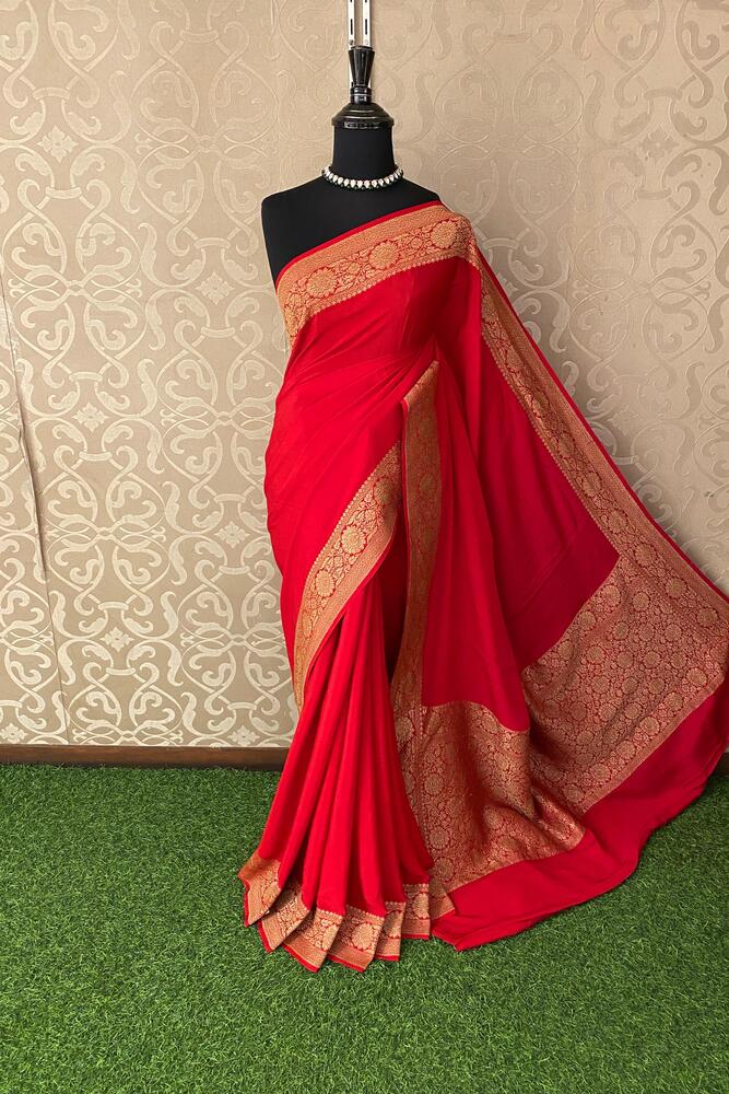 Cherry red Mysore crepe silk Banarasi saree with intricate gold zari work, paired with an unstiched matching blouse.