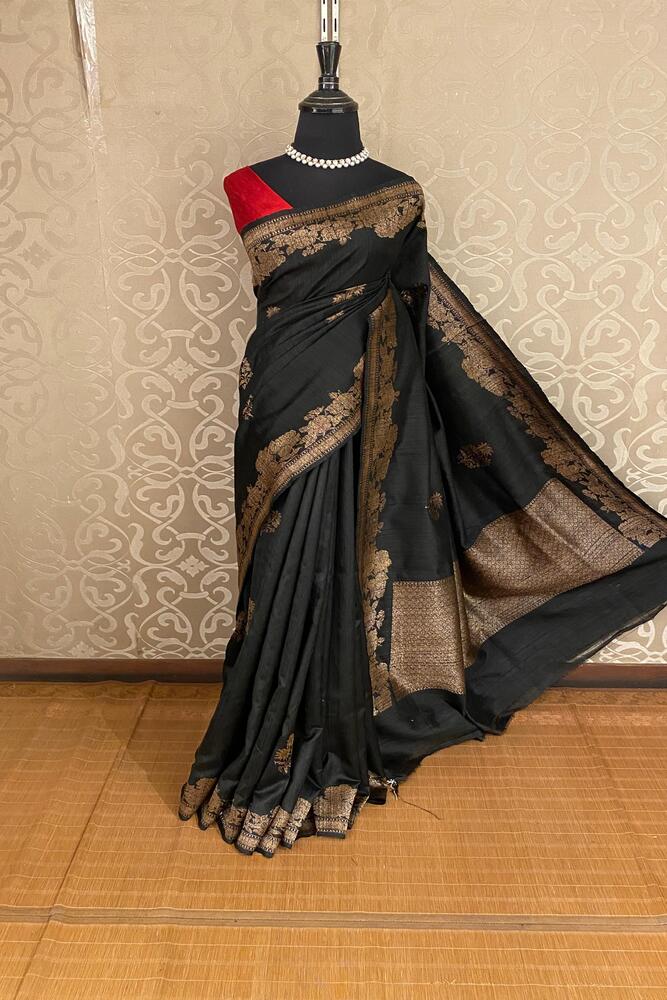 Black pure raw Tussar Banarasi silk saree with handwoven motifs and matching unstiched blouse from Saarang Sarees.