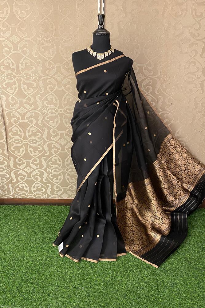 Black Kora Banarasi silk saree with handwoven work and unstitch blouse, traditional wear by Saarang Sarees.