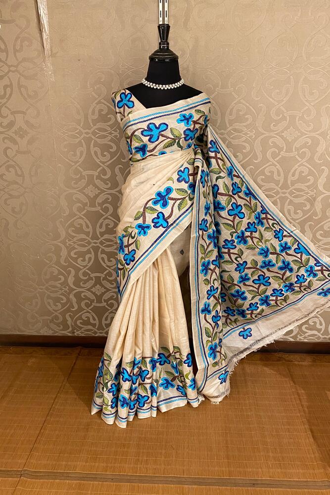 Beige Tussar embroidery saree with Kantha work border and unstitched blouse, traditional wear by Saarang Sarees, shown draped.