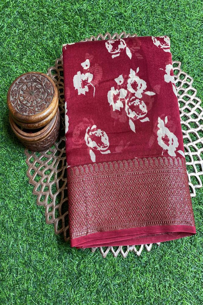 Maroon cotton Chanderi saree with intricate gold border and matching unstiched blouse, traditional wear by Saarang Sarees.
