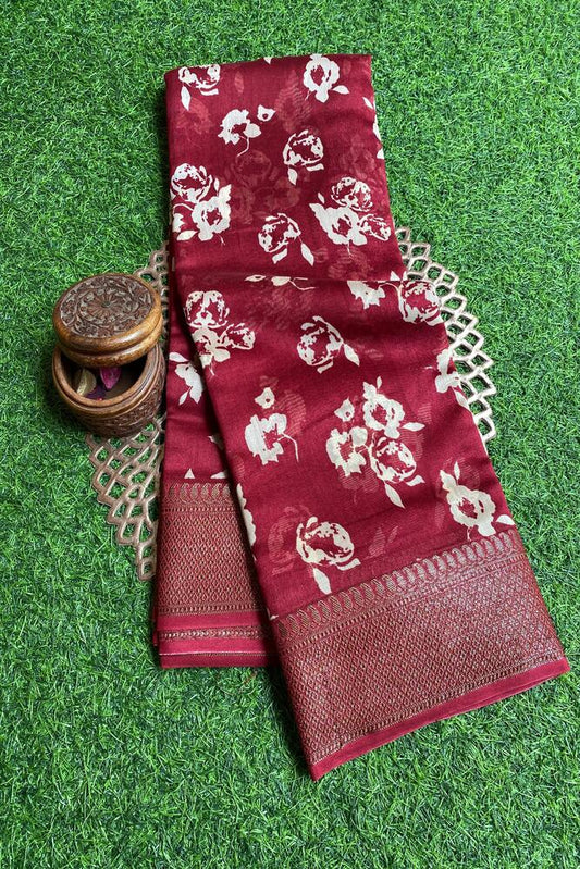 Maroon cotton Chanderi saree with intricate traditional patterns, paired with an unstiched blouse by Saarang Sarees.