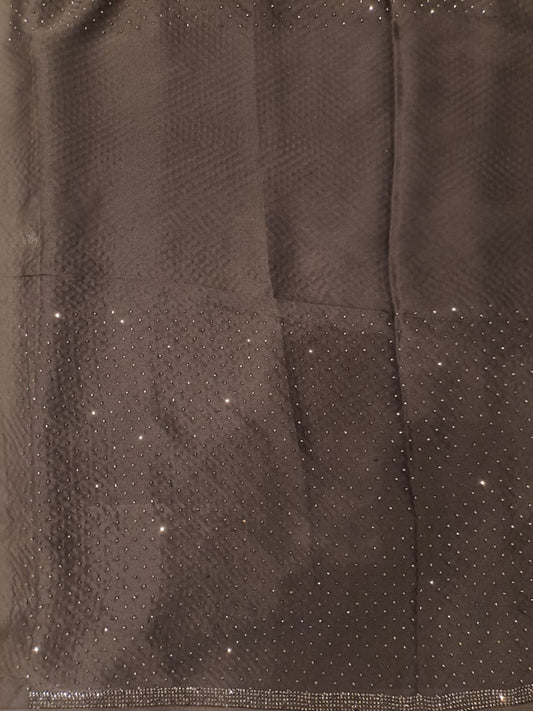 Black satin crepe silk saree with stone work and unstiched blouse, perfect for party wear by Saarang Sarees.