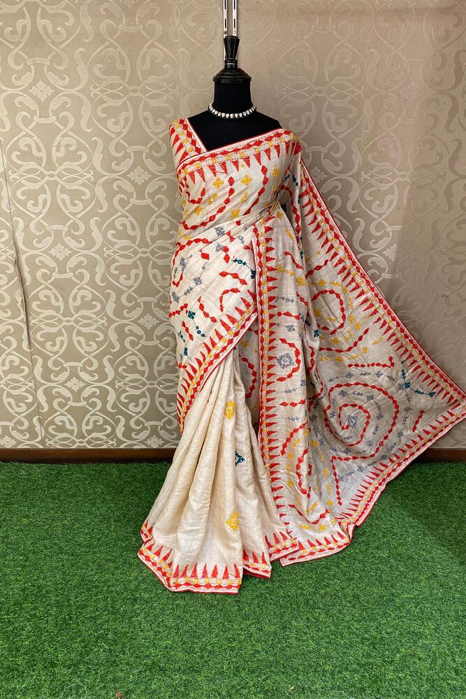 Beige Tussar Lambani and Kutch work saree with stitched blouse, traditional Indian wear by Saarang Sarees.