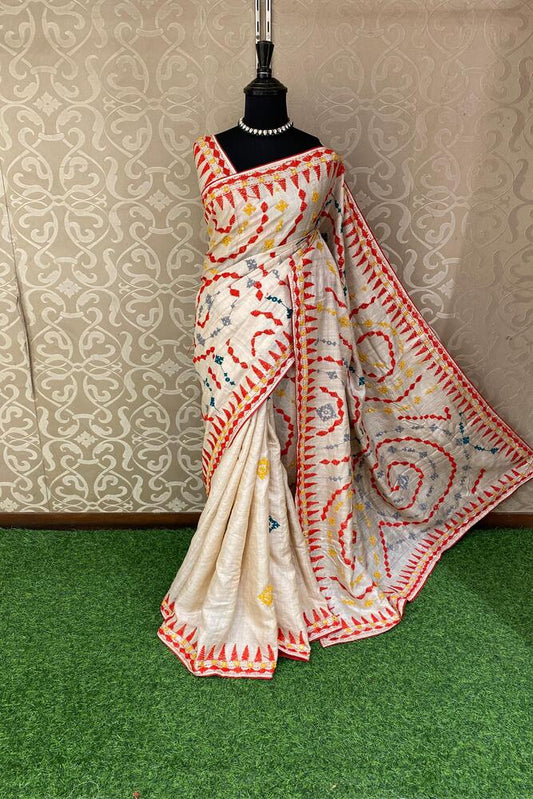 Beige Tussar Lambani and Kutch work saree with stitched blouse, traditional Indian wear by Saarang Sarees.