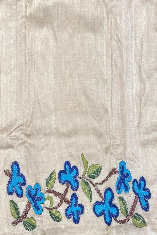 Beige Tussar embroidery saree with Kantha work border and unstitched blouse from Saarang Sarees, traditional Indian attire.