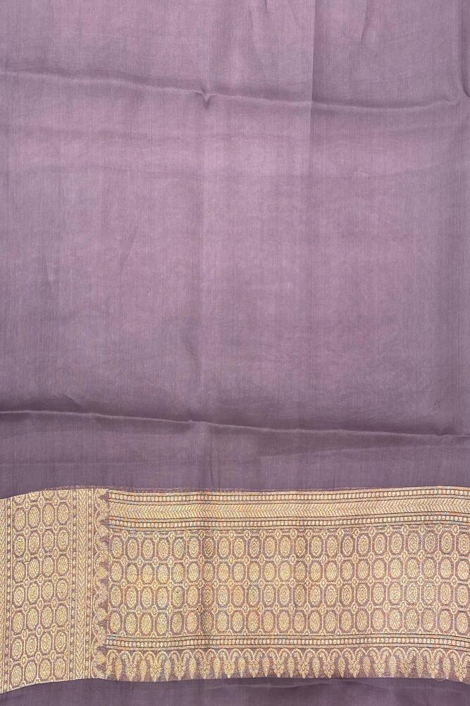 Mauve purple Kora Banarasi silk saree with intricate hand weaving work and an unstiched blouse, traditional wear from Saarang Sarees.