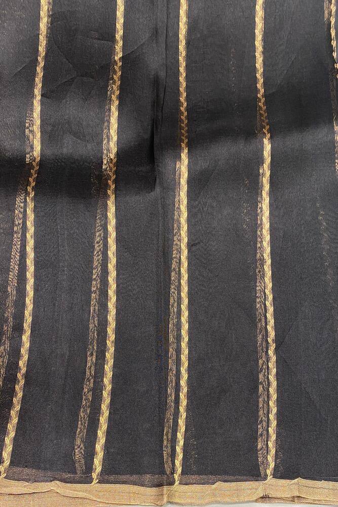 Black Kora Banarasi silk saree with handwoven work and unstiched blouse, traditional wear by Saarang Sarees.