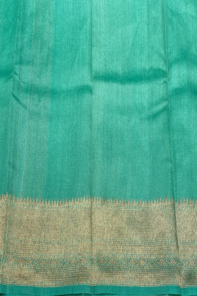 Offwhite Tussar Banarasi silk saree with handwoven motifs and unstiched blouse, traditional wear by Saarang Sarees.