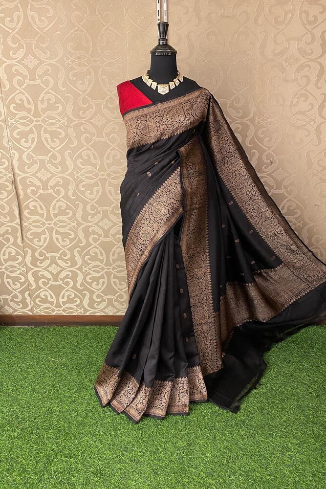 Black pure raw Tussar Banarasi silk saree with hand-woven motifs and an unstiched blouse, traditional wear by Saarang Sarees.