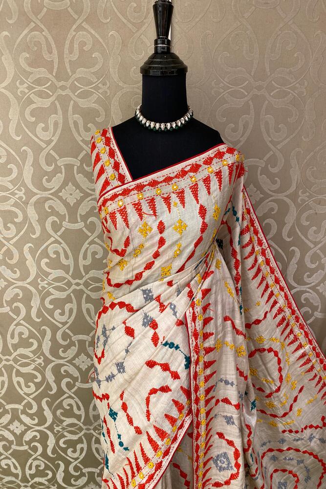 Beige Tussar Lambani and Kutch work saree with stitched blouse, traditional wear by Saarang Sarees, showcasing intricate embroidery and fabric.