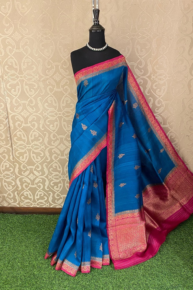 Royal blue Tussar Banarasi silk saree with handwoven motifs and matching unstitched blouse, traditional wear by Saarang Sarees.