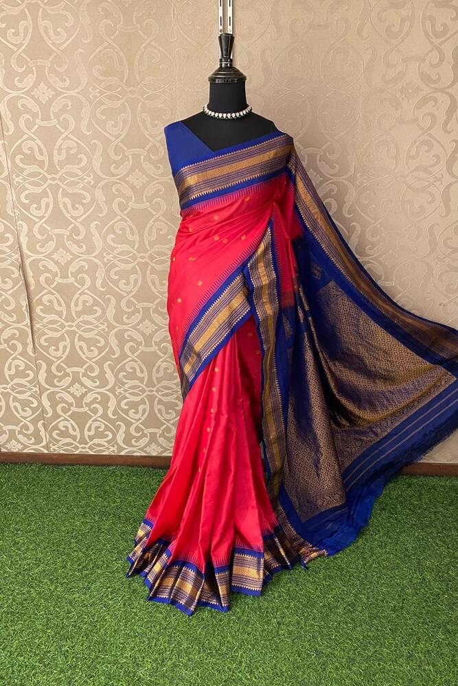 Magenta Gadwal silk saree with intricate traditional patterns and an unstiched blouse from Saarang Sarees, showcasing vibrant craftsmanship.