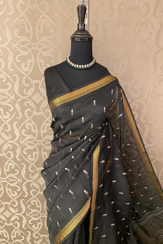 Black pure linen Kashmiri work saree with traditional design and unstiched blouse from Saarang Sarees, displayed flat.