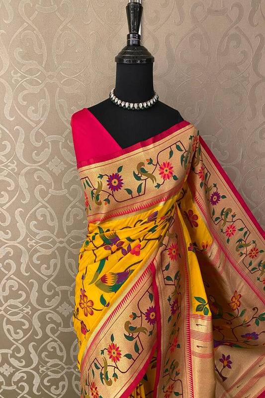 Mustard yellow and purple Paithani silk saree with traditional gold zari work and matching unstiched blouse from Saarang Sarees.